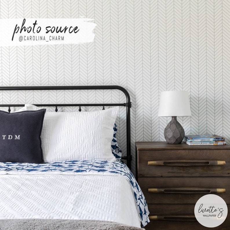 Sage green herringbone wallpaper in a Scandinavian interior design bedroom