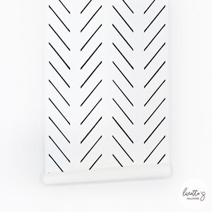 Panel of the minimalistic herringbone wallpaper in black and white