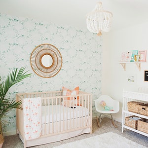 Green palm leaf removable wallpaper in a boho style nursery