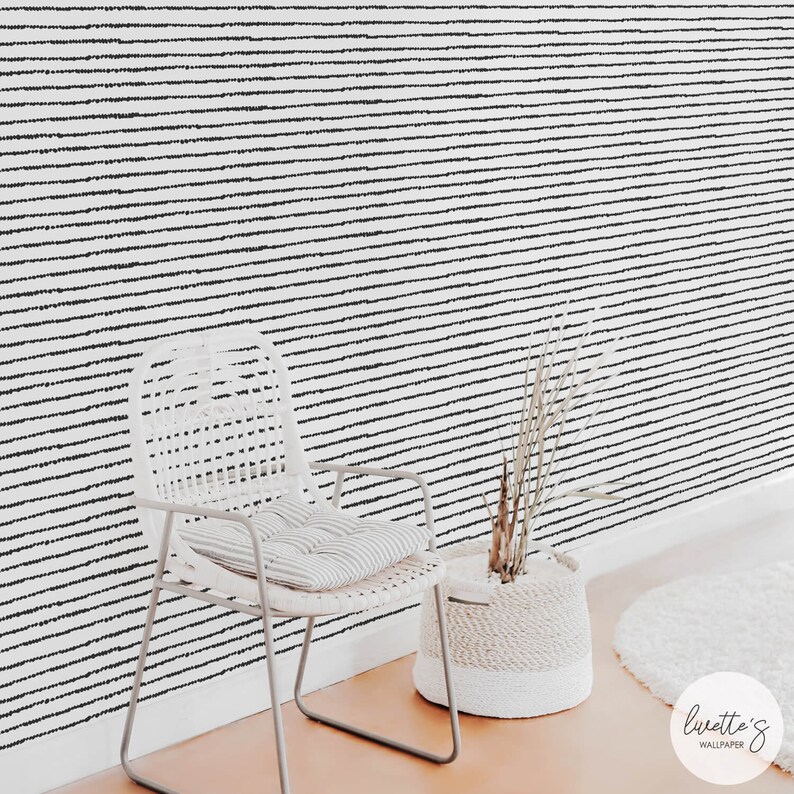 Black and white dots wallpaper in a scandinavian interior design