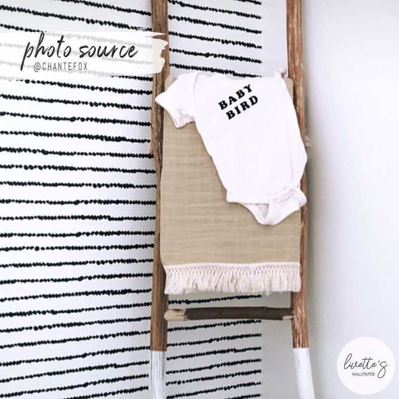 Scandinavian boho dots removable wallpaper in a baby room
