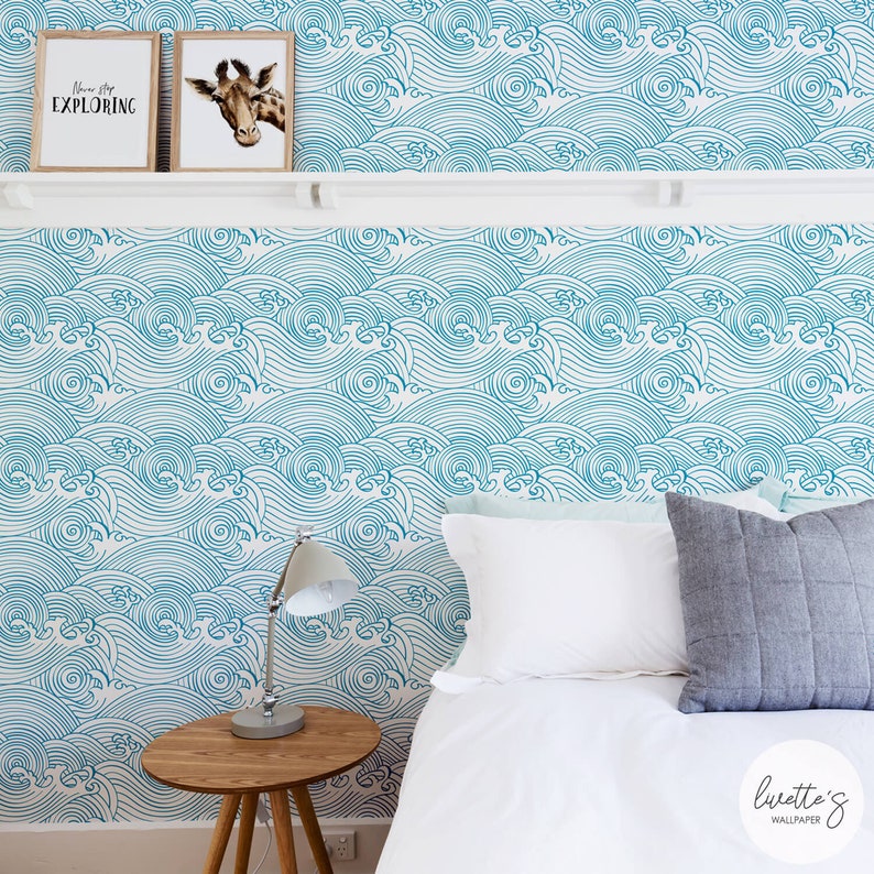 Blue wave wallpaper in a costal design bedroom