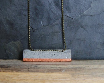 A modern pendant bar in CONCRETE with COPPER leaf. A perfect unique Christmas gift handmade. The pendant is minimal and modern