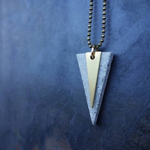TRIANGLE PENDANT NECKLACE. Cement triangle gray or black. A perfect Christmas architect or engineer gift, with a little triangle in brass.