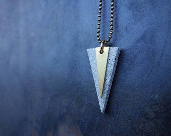 TRIANGLE PENDANT NECKLACE. Cement triangle gray or black. A perfect Christmas architect or engineer gift, with a little triangle in brass.