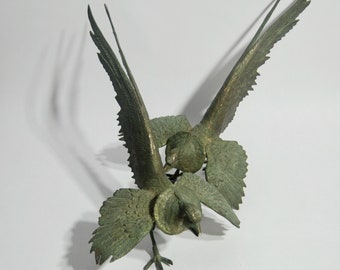 Vintage aged brass fighting birds, fighting cocks