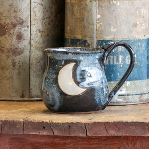 Starry Night handmade stoneware pottery mug with thumb dents for gripping ,  Crescent moon and star cup ,  Midnight blue pottery coffee cup