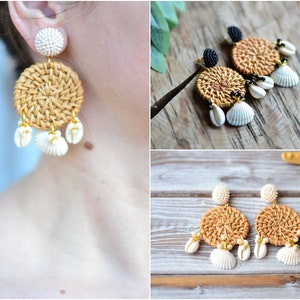May include: A pair of woven rattan earrings with white shell accents. The earrings are round and have a gold-tone finish.