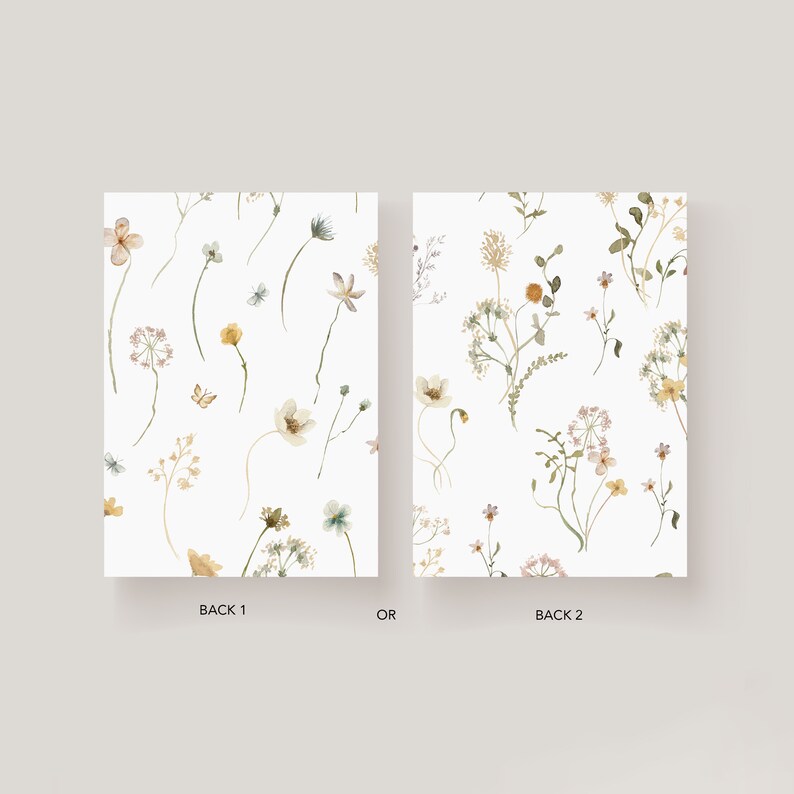 May include: Two different designs for a floral patterned card. The first design features a light pink flower, yellow flowers, and green leaves. The second design features a white flower, yellow flowers, and green leaves. Both designs have a white background.