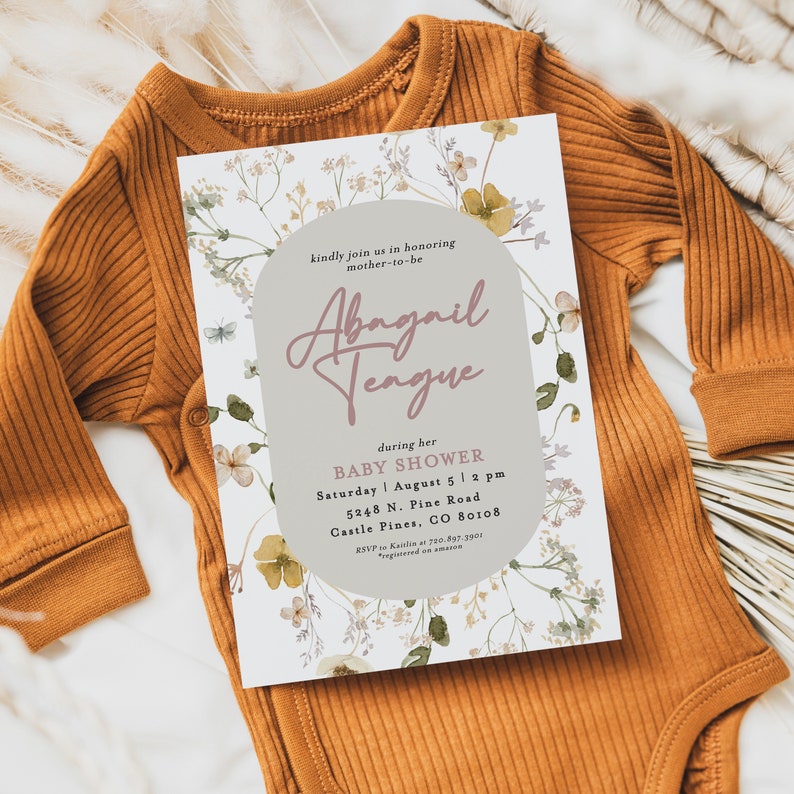 May include: A floral baby shower invitation with a light grey background and a light brown circle with the text "kindly join us in honouring mother-to-be Abagail Tengue" in pink script. The invitation details the date, time, and location of the shower.