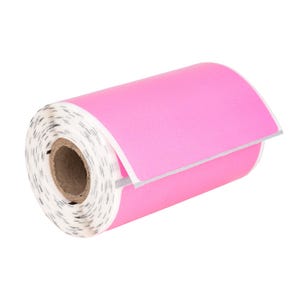 May include: A roll of bright pink labels with a white backing and a cardboard core. The labels are partially unrolled, revealing the adhesive side. The roll is set against a white background.