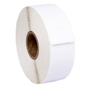 May include: A roll of white adhesive labels with a brown core. The labels are rectangular and have a serrated edge.