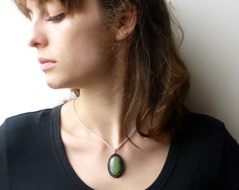 Silver pendant with green, marbled stone, pendant in blackened silver with corded wire