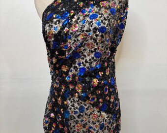 Exclusive and unique multicolored sequin on mesh fabric sold by the yard
