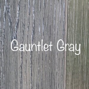 May include: Close-up of a wood grain texture painted in a gray color with the text "Gauntlet Gray" written in white.