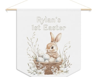 Celebrate your baby's 1st Easter with this personalized pennant banner wall hanging featuring a watercolor bunny for kids room or nursery