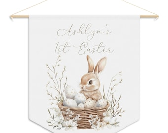 Celebrate your baby's 1st Easter with this personalized pennant banner wall hanging featuring a watercolor bunny for kids room or nursery
