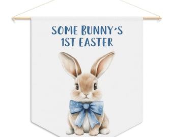 Some Bunny's 1st Easter pennant style hanging banner featuring watercolor bunny with blue, pink or green bow for kids' room or nursery