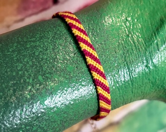 Adjustable Magenta & Yellow Striped Knotted Thread Friendship Bracelet