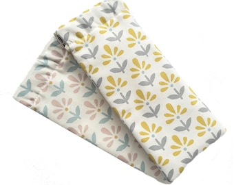 May include: Two fabric pouches with floral patterns. One pouch has a yellow and gray floral pattern, and the other has a pink and blue floral pattern.