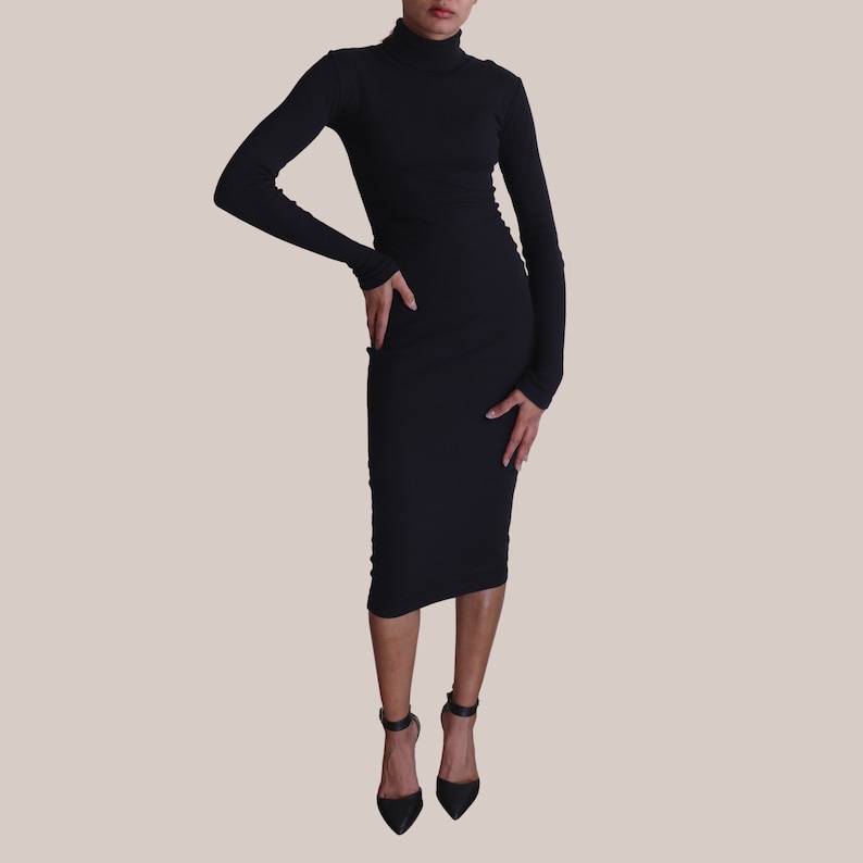 May include: A black mock neck midi dress with long sleeves.