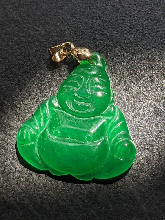 Big and well carved green jade Buddha pendant