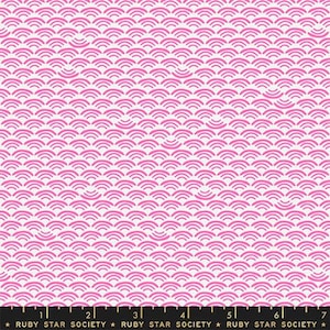 May include: White fabric with a repeating pattern of pink overlapping semi-circles. The fabric has a ruler with the text "Ruby Star Society" printed on it.