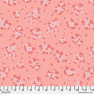 May include: Coral fabric with a repeating pattern of white and red floral clusters and scattered leaves. The fabric is measured in inches, with a scale from 1 to 12 inches.