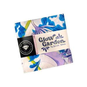 May include: A fabric charm pack from the Glow Garden collection by Sarah Watts. The fabric squares feature a floral design in blue, purple, and yellow on a white background. The pack is secured with a black band that reads "Ruby Star Society."