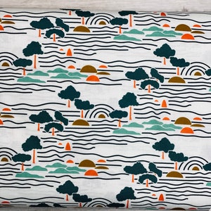 May include: White fabric with a repeating pattern of dark green trees, orange suns, brown hills, and thin black wavy lines.