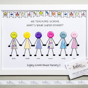 May include: A framed illustration of six stick figures holding hands, each with a different colored button for a head. The illustration is titled "We teach pre-school, what's your super power?" and includes the text "Eagley School House Nursery 2".