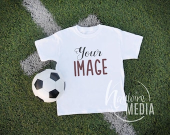Blank White T-Shirt Apparel Mockup, Sport Design Styled Stock Photography, Flat Mock Up Shirt, Top View on Soccer Background - JPG Download