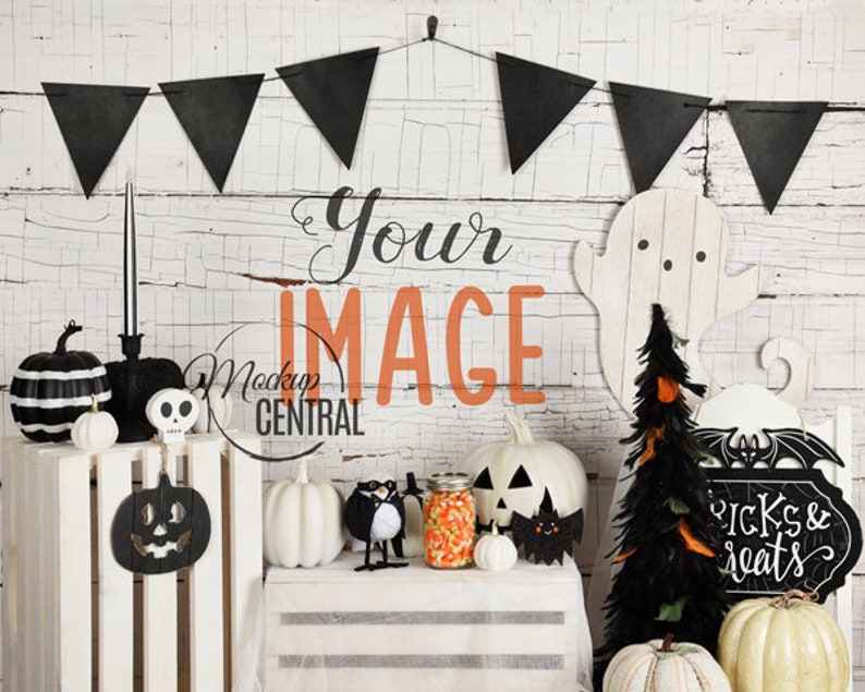 May include: Halloween themed decorations including a black and white striped pumpkin, a black and white skull, a white ghost, a black feather tree, a black and white sign that says "tricks & treats", and a white pumpkin with a black jack-o-lantern face.