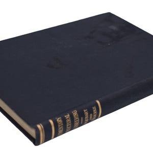 May include: A dark blue hardcover book with a rectangular shape. The spine features gold lettering that reads Elementary Structural Engineering by Urquhart and O'Rourke, with the publisher McGraw-Hill Company visible at the top of the spine.