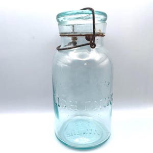 Blauwe glazen pot met borgtocht Putnam 284: vintage inmaakpot