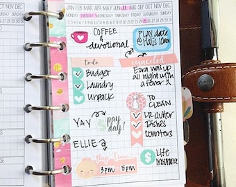 May include: A pink and white planner with a daily schedule and to-do list. The planner has stickers with the words "Coffee & Devotional", "Play Date", "To Clean", "Life Insurance", and "Nap Time".