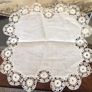 Hand crocheted edged doily 10 x 10
