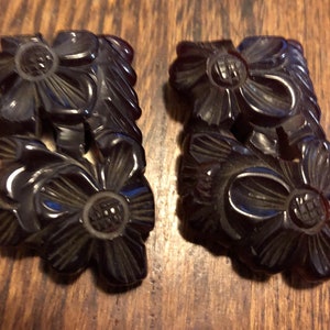 Vintage Bakelite carved brown shoe clips.
