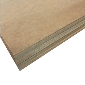 May include: A stack of brown particleboard sheets. The sheets are stacked on top of each other, with the edges of the sheets visible.