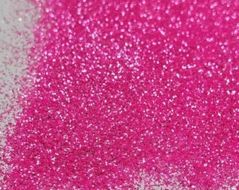 May include: A close-up of a bright pink glitter, perfect for crafting and adding sparkle to projects.