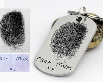 May include: A silver dog tag keychain with a fingerprint design and the inscription "From Mum xx".