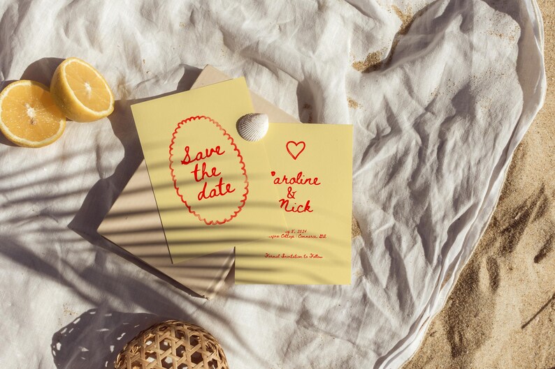 May include: A yellow card with red text that says "Save the date" and a red heart. Below the heart is the text "Caroline & Nick" with a date and location.