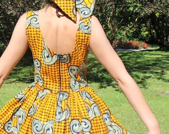 Stylish Bright Backshow Yellow Cotton African Fabric Summer Mini Round Dress with a Matching Hat, embellished with the African Fabric