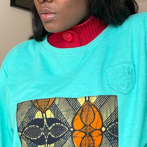 Unisex up-cycled warm mint green sweater pullover with an African Print on Front for men and women XS S M L XL