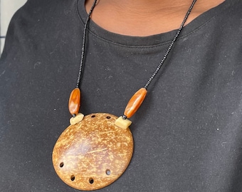 Handmade African Locket Necklace With a Polished Coconut Endocarp Pendant