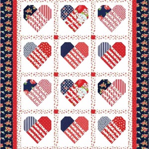 May include: A white quilt with a red, white and blue patchwork design. The quilt is made up of nine hearts, each with a different pattern. The hearts are surrounded by a border of red, white and blue flowers.