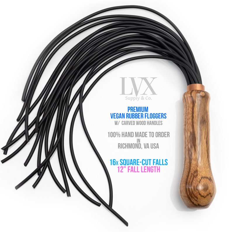 May include: A black vegan rubber flogger with a carved wooden handle. The flogger has 16 square-cut falls and a 12-inch fall length. The text on the handle reads "LVX Supply & Co. Premium Vegan Rubber Floggers W/ Carved Wood Handles 100% Hand Made To Order In Richmond, VA USA 16x Square-Cut Falls 12" Fall Length".