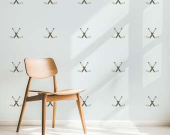 May include: A light wood chair with a white wall behind it. The wall has a pattern of hockey sticks crossed in an 'X' shape.
