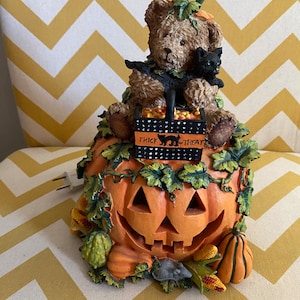Adorable teddy bear on a pumpkin Halloween light
