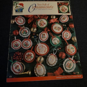 Pattern for 17 Christmas cross stitch ornaments. From true colors